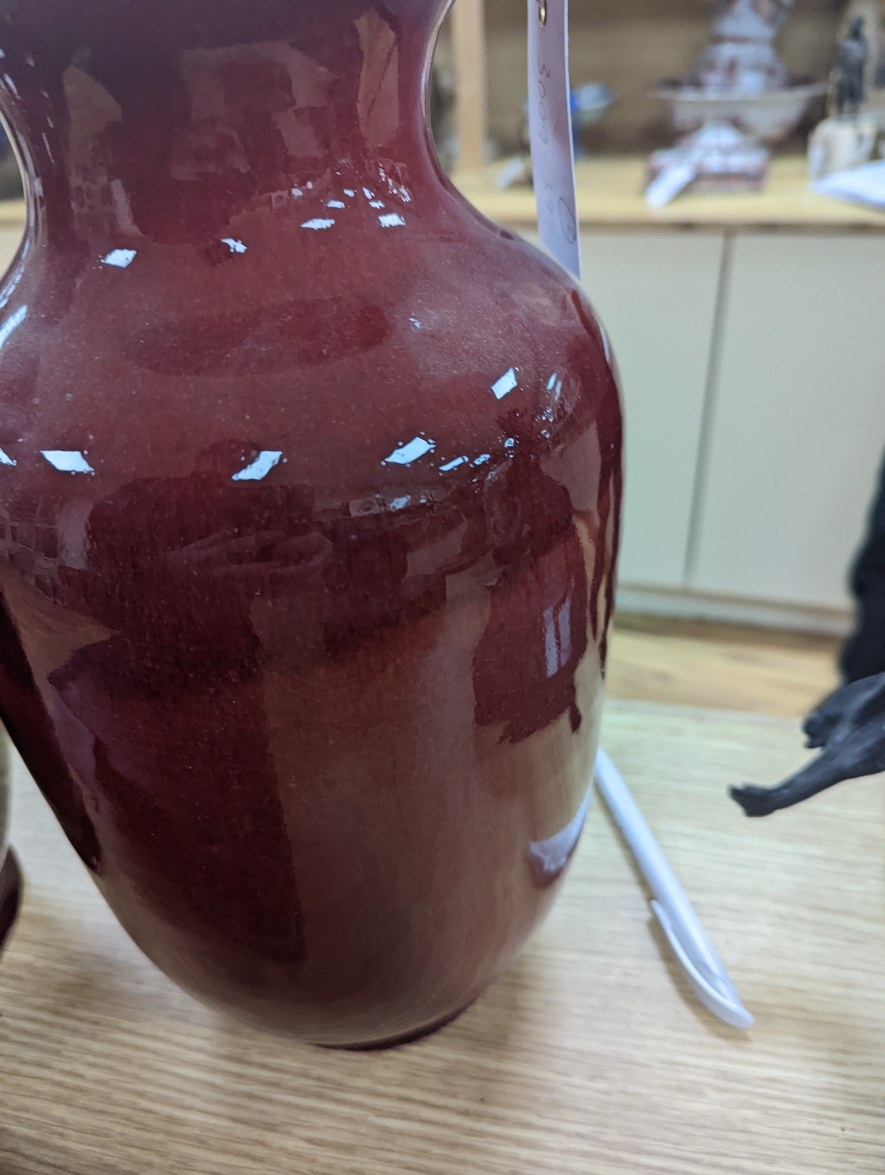 Two large Chinese sang de boeuf glazed vases tallest 36cm